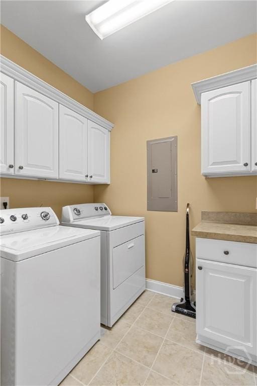 204 River Oaks Dr, Richmond Hill, GA 31324 - laundry area featuring separate washer and dryer, cabinet space, electric panel, baseboards, and light tile patterned floors
