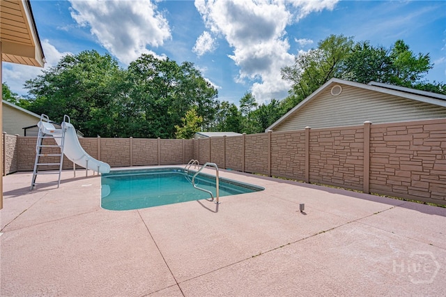 145 New Stillwell Rd, Springfield, GA 31329 - view of pool featuring a water slide, a patio area, and a fenced backyard