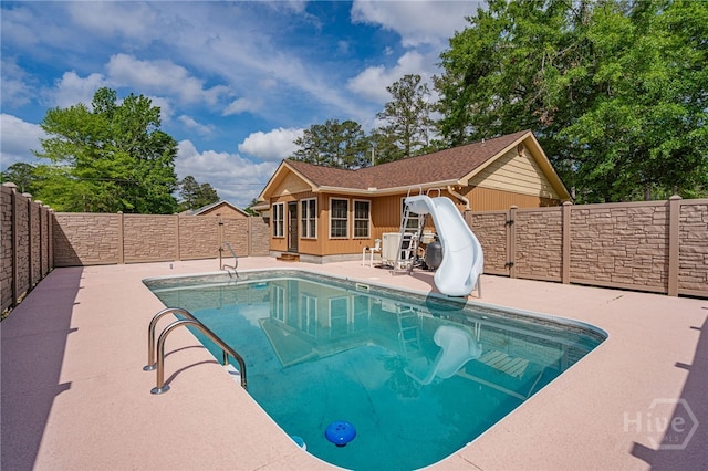 145 New Stillwell Rd, Springfield, GA 31329 - view of pool with a water slide, a fenced backyard, and a patio