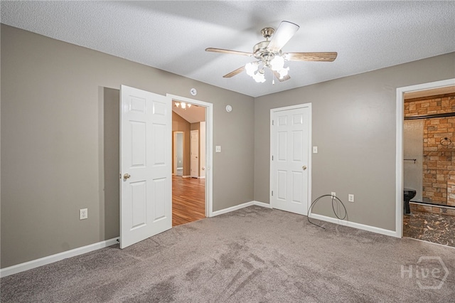 145 New Stillwell Rd, Springfield, GA 31329 - unfurnished bedroom with carpet floors, baseboards, a textured ceiling, ceiling fan, and ensuite bathroom