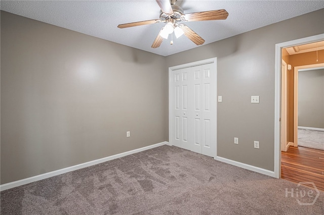 145 New Stillwell Rd, Springfield, GA 31329 - unfurnished bedroom with attic access, carpet flooring, a closet, baseboards, and ceiling fan