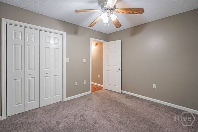 145 New Stillwell Rd, Springfield, GA 31329 - unfurnished bedroom with carpet, baseboards, a closet, a ceiling fan, and a textured ceiling