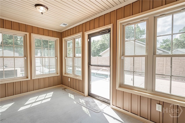 145 New Stillwell Rd, Springfield, GA 31329 - unfurnished sunroom with healthy amount of natural light, wood walls, baseboards, and wooden ceiling