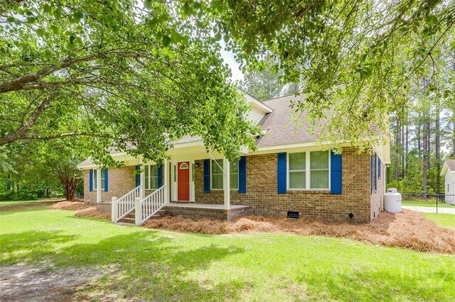 1282 Long Bridge Rd, Rincon, GA 31326 - view of front facade featuring crawl space, brick siding, covered porch, and roof with shingles