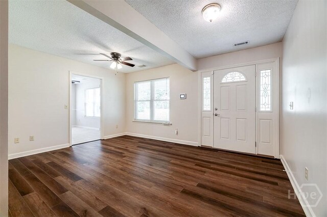 1282 Long Bridge Rd, Rincon, GA 31326 - entrance foyer featuring a textured ceiling, dark wood-style floors, ceiling fan, baseboards, and beam ceiling