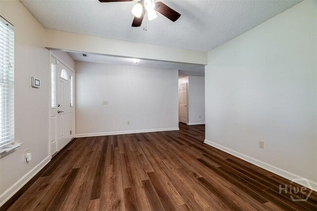 1282 Long Bridge Rd, Rincon, GA 31326 - spare room with ceiling fan, dark wood finished floors, baseboards, a textured ceiling, and healthy amount of natural light