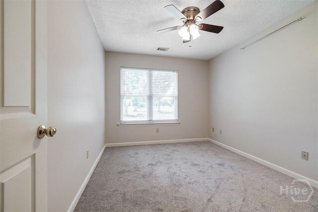 1282 Long Bridge Rd, Rincon, GA 31326 - unfurnished room with a textured ceiling, carpet flooring, ceiling fan, and baseboards