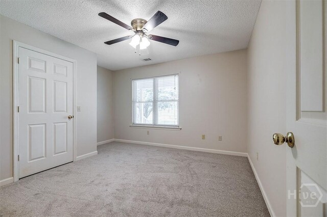 1282 Long Bridge Rd, Rincon, GA 31326 - carpeted spare room featuring a textured ceiling, baseboards, and ceiling fan