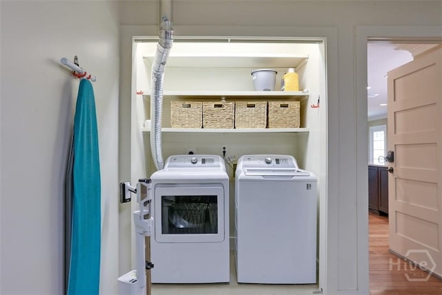 6 Cutty Sark Rd, Savannah, GA 31410 - washroom with washer and clothes dryer and wood finished floors