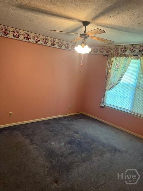 887 Piercefield Dr, Richmond Hill, GA 31324 - empty room with a textured ceiling, ceiling fan, baseboards, and dark carpet
