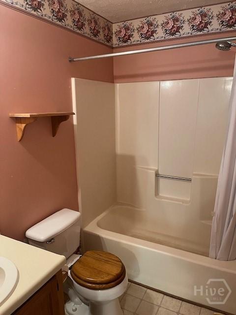 887 Piercefield Dr, Richmond Hill, GA 31324 - bathroom with toilet, tile patterned flooring, shower / bath combination with curtain, vanity, and a textured ceiling