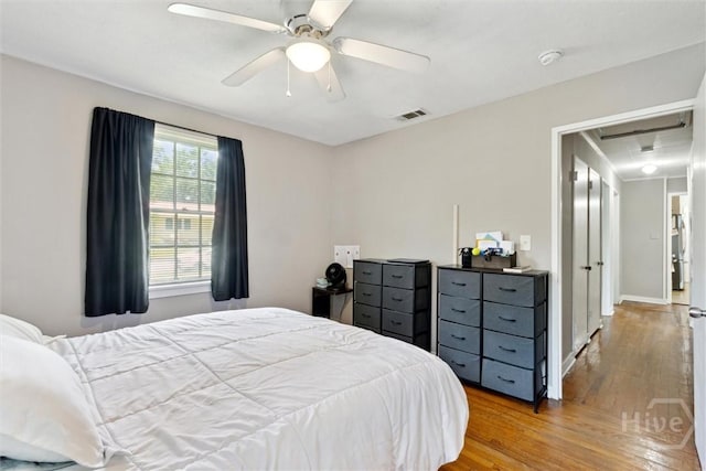 103 Pine Valley Rd, Savannah, GA 31404 - bedroom with wood finished floors, ceiling fan, attic access, and baseboards