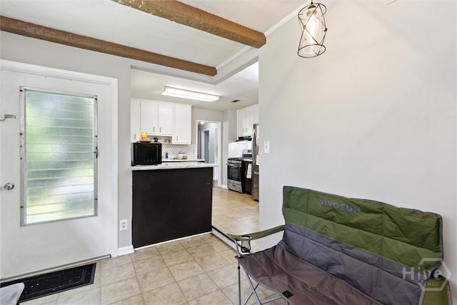 103 Pine Valley Rd, Savannah, GA 31404 - kitchen featuring appliances with stainless steel finishes, decorative backsplash, white cabinets, light countertops, and light tile patterned flooring