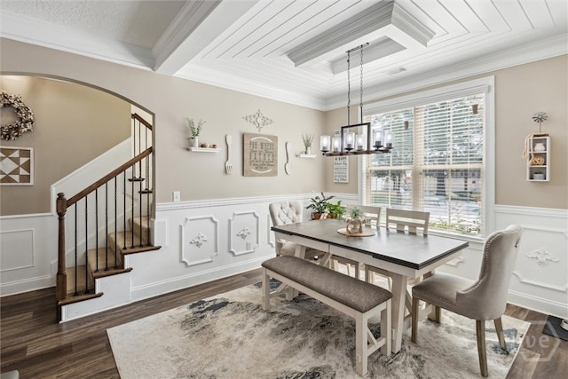 110 Vintage Dr, Guyton, GA 31312 - dining space with dark wood finished floors, ornamental molding, a decorative wall, stairs, and a chandelier