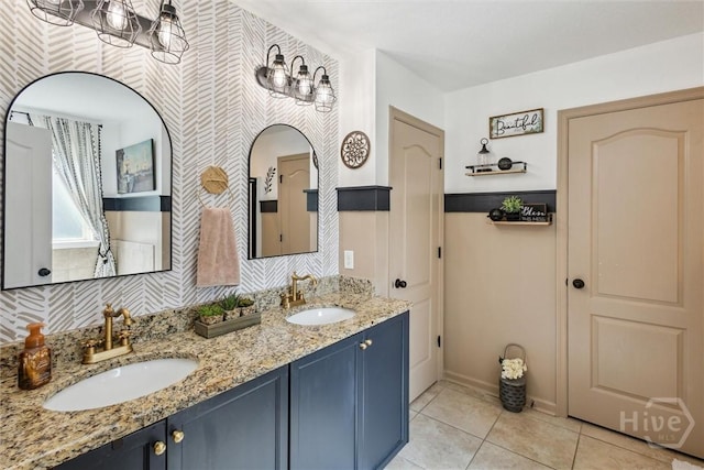 110 Vintage Dr, Guyton, GA 31312 - full bathroom with double vanity, tile patterned flooring, wallpapered walls, and baseboards