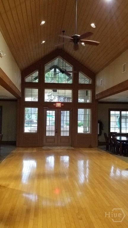 182 Brookline Dr, Savannah, GA 31407 - unfurnished living room featuring high vaulted ceiling, wood finished floors, a ceiling fan, and wooden ceiling