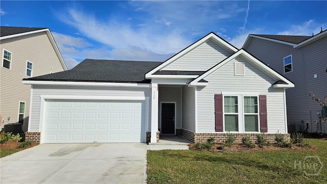 182 Brookline Dr, Savannah, GA 31407 - view of front of house featuring driveway, a garage, and a front lawn