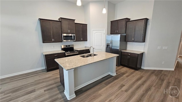 182 Brookline Dr, Savannah, GA 31407 - kitchen featuring appliances with stainless steel finishes, a sink, dark brown cabinets, backsplash, and dark wood finished floors