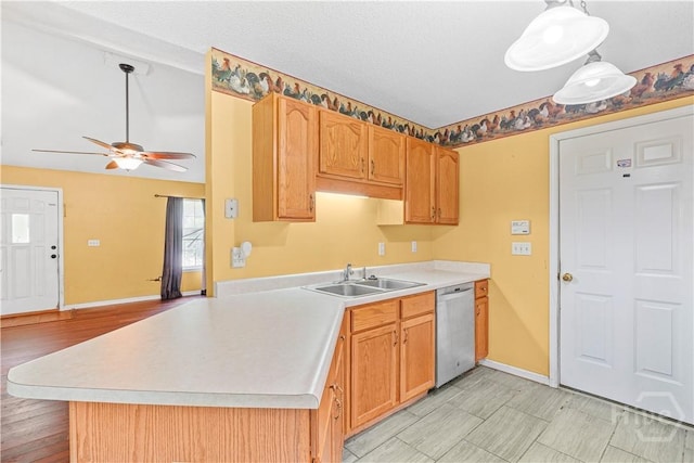 115 Ashley Dr, Guyton, GA 31312 - kitchen with dishwasher, ceiling fan, light countertops, a sink, and baseboards
