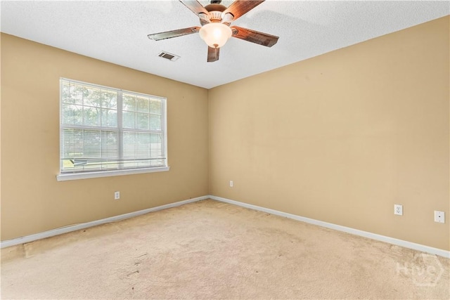 115 Ashley Dr, Guyton, GA 31312 - empty room with light carpet, a ceiling fan, baseboards, and a textured ceiling