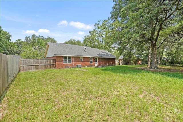 115 Ashley Dr, Guyton, GA 31312 - back of house with brick siding and central air condition unit