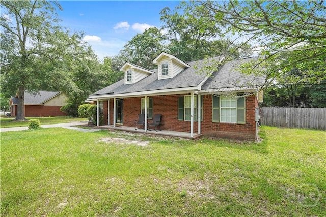 115 Ashley Dr, Guyton, GA 31312 - view of front of house featuring a porch, brick siding, and roof with shingles