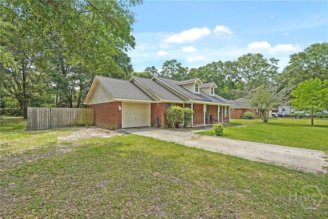 115 Ashley Dr, Guyton, GA 31312 - view of front of home featuring brick siding, a garage, concrete driveway, and covered porch