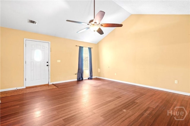 115 Ashley Dr, Guyton, GA 31312 - empty room featuring ceiling fan, lofted ceiling, wood finished floors, baseboards, and plenty of natural light