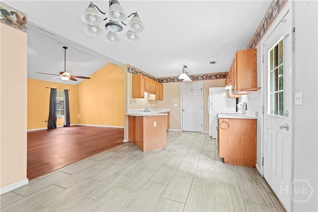 115 Ashley Dr, Guyton, GA 31312 - kitchen featuring a chandelier, light countertops, open floor plan, baseboards, and light wood-style flooring