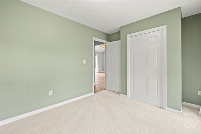 25 Ashley Ct, Richmond Hill, GA 31324 - unfurnished bedroom with baseboards, a closet, and carpet floors