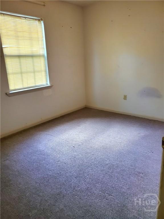 1029 Richards St, Savannah, GA 31415 - spare room with carpet flooring and baseboards