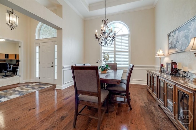 354 Brown Thrush Rd, Savannah, GA 31419 - dining area featuring a chandelier, dark wood-style floors, wainscoting, crown molding, and a high ceiling