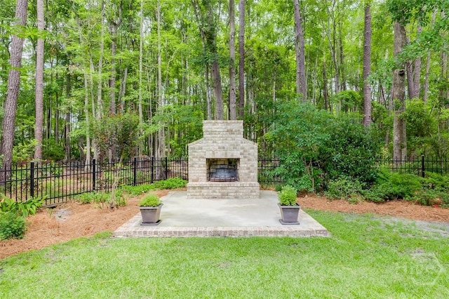 354 Brown Thrush Rd, Savannah, GA 31419 - view of yard with an outdoor brick fireplace and a patio area