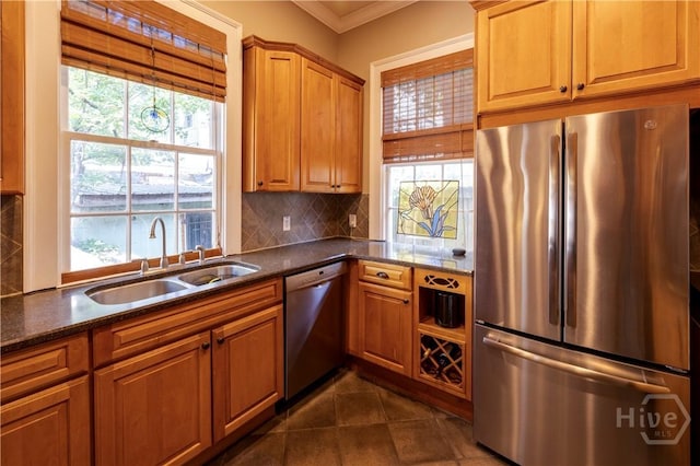 120 Brady St, Savannah, GA 31401 - kitchen with stainless steel appliances, a sink, tasteful backsplash, plenty of natural light, and ornamental molding