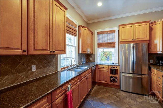 120 Brady St, Savannah, GA 31401 - kitchen featuring appliances with stainless steel finishes, a sink, decorative backsplash, dark stone counters, and ornamental molding
