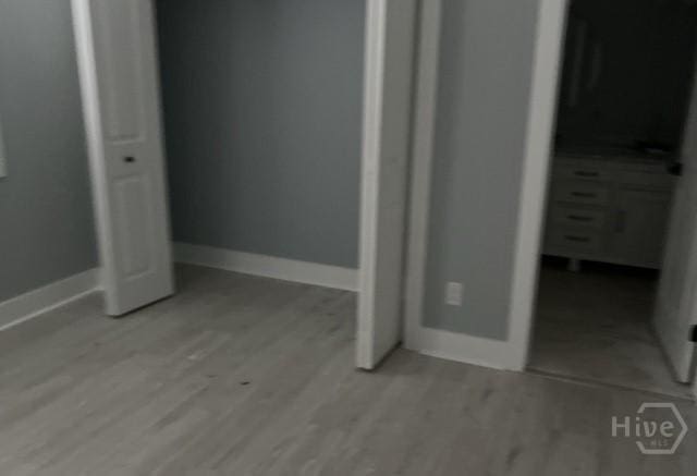716 W 51st St, Savannah, GA 31405 - unfurnished bedroom featuring light wood-style flooring and baseboards