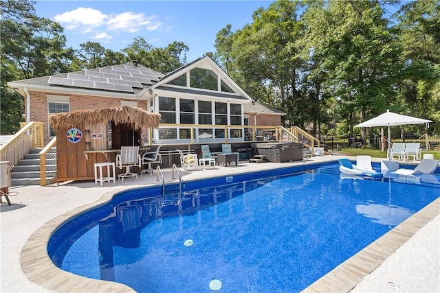 245 Montauk Dr, Richmond Hill, GA 31324 - outdoor pool with a jacuzzi, a patio area, and stairway