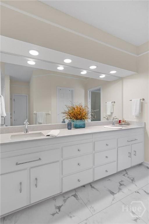 245 Montauk Dr, Richmond Hill, GA 31324 - full bath featuring marble look tile flooring, double vanity, and recessed lighting