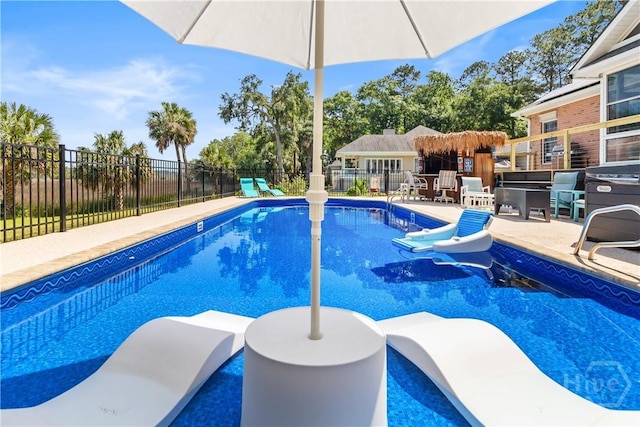 245 Montauk Dr, Richmond Hill, GA 31324 - view of swimming pool featuring a patio