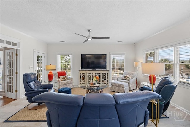 245 Montauk Dr, Richmond Hill, GA 31324 - living room with a ceiling fan, a textured ceiling, baseboards, and ornamental molding