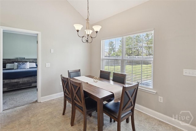65 Norton St NE, Ludowici, GA 31316 - dining space featuring a chandelier, vaulted ceiling, and baseboards