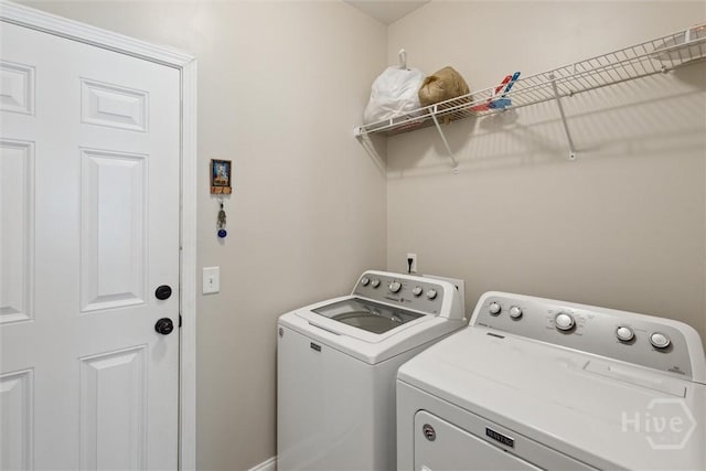 65 Norton St NE, Ludowici, GA 31316 - laundry room featuring washing machine and clothes dryer and baseboards