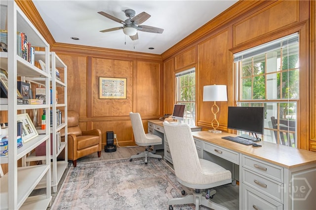 22 Sparnel Rd, Savannah, GA 31411 - office area with ornamental molding, wood finished floors, a ceiling fan, built in study area, and wood walls