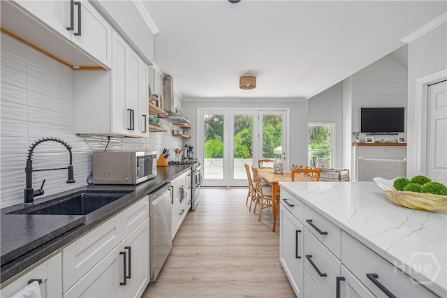 22 Sparnel Rd, Savannah, GA 31411 - kitchen with appliances with stainless steel finishes, a sink, decorative backsplash, ornamental molding, and white cabinets