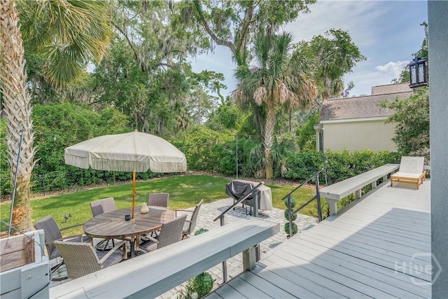 22 Sparnel Rd, Savannah, GA 31411 - wooden terrace with outdoor dining space and a lawn