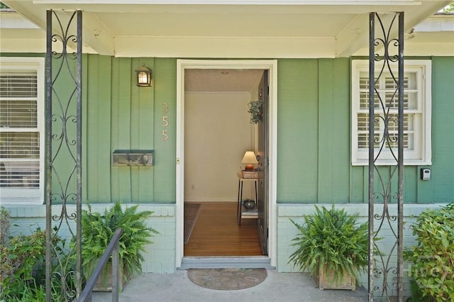 355 Riverview Dr, Savannah, GA 31404 - property entrance featuring covered porch and board and batten siding