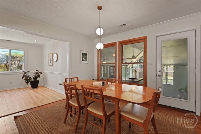 355 Riverview Dr, Savannah, GA 31404 - dining area with wood finished floors, ornamental molding, and baseboards