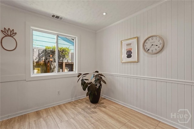 355 Riverview Dr, Savannah, GA 31404 - unfurnished room with ornamental molding, baseboards, and wood walls