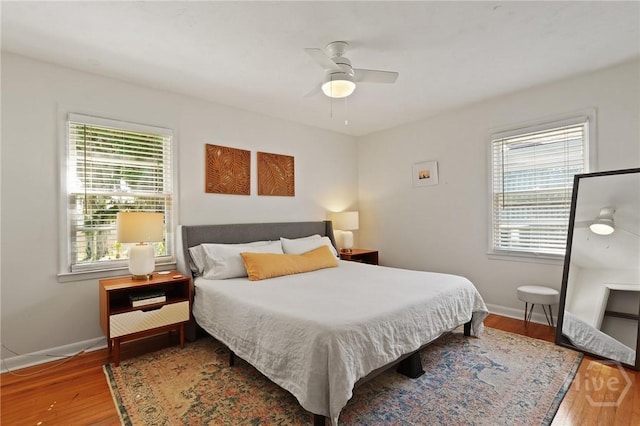355 Riverview Dr, Savannah, GA 31404 - bedroom with wood finished floors, baseboards, and ceiling fan