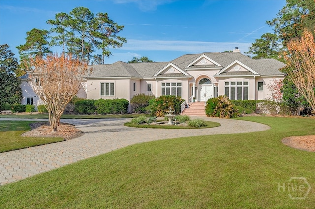 4 Longwater Ln, Savannah, GA 31411 - view of front of home with a front lawn and stucco siding